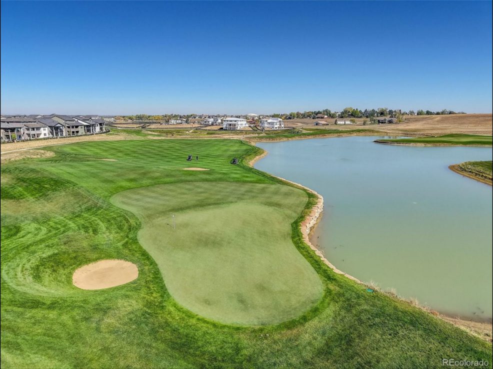 A TPC Colorado green beside the lake in Heron Lakes