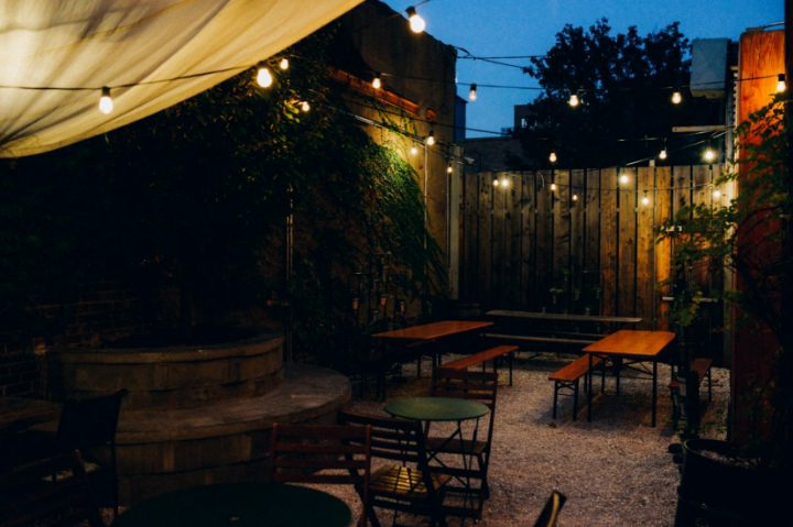 Restaurant patio with string lights at dusk (stock photo)